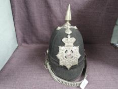 A late 19th/early 20th century 1st Volunteer Battalion Border Regiment Cloth Spiked Helmet, having