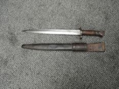 A British Lee-Mertford Mk1 1888 Bayonet, marked EFD and other marks with leather scabbard and