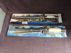 Two modern reproduction German WWII Daggers with scabbards in card boxes