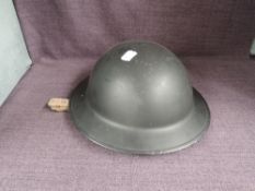A WWII British Chaplain/Padre Steel Helmet with leather liner and webbed chin strap