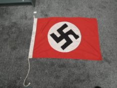 A German WWII Flag, marked Military Mark Berlin 1939 NSDAP, 89cm x 59cm
