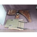 A military related collection, Leather Holster, pair of Canvas Puttees, Compass in leather case by C