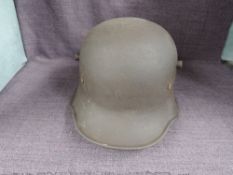 A German WWI Steel Helmet having leather liners, no markers marks or decals seen