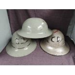 Three British Steel Helmets, first silver helmet has painted CD and Lighning Bolt with leather liner