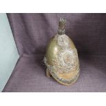 A 19th century Brass Helmet with The Royal Dragoons Helmet Plate having metal chin strap, af leather