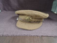 A WWI British Army Cap having ASC Army Service Corps Badge, marked inside with Military Arrow,