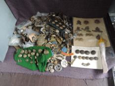 A large collection of metal Military Badges & Buttons, needs viewing