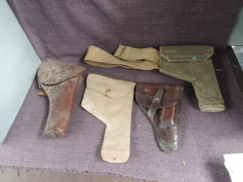 Two leather Holsters and two canvas Holsters, one with belt