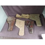 Two leather Holsters and two canvas Holsters, one with belt