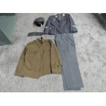 A reproduction WWII German Uniform consisting of Peak Cap, two Jackets and Trousers along with a