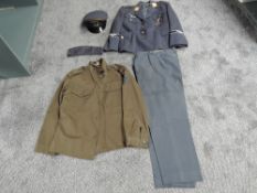 A reproduction WWII German Uniform consisting of Peak Cap, two Jackets and Trousers along with a