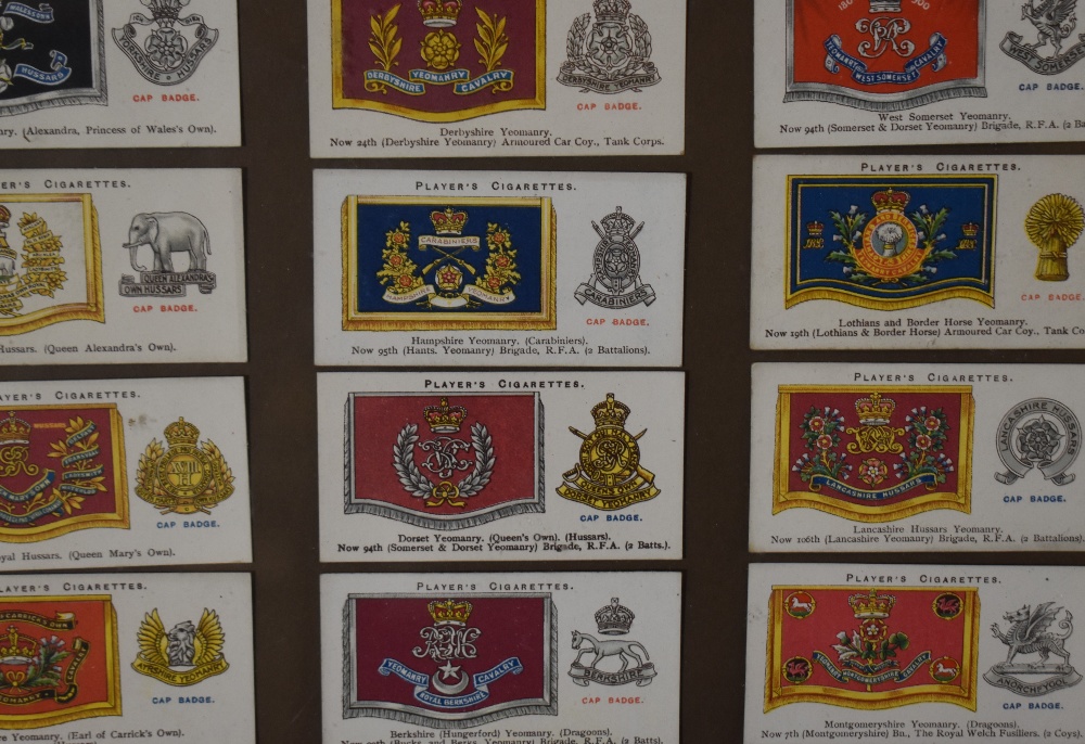 An assorted collection of framed cigarette cards, comprising Player's regiments, coats of arms, - Image 4 of 4