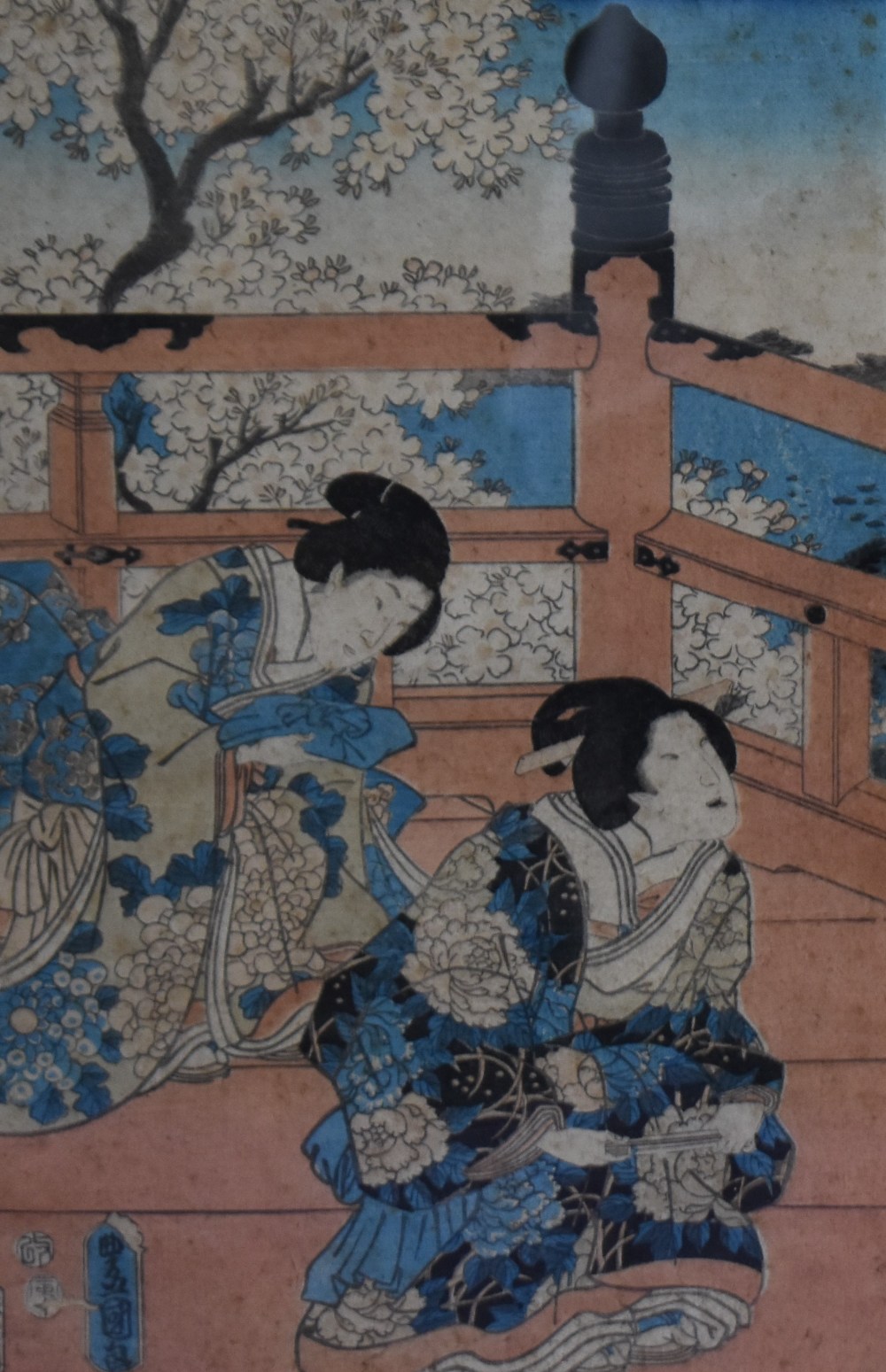 Two Japanese woodblock prints, both depicting Geisha women wearing blue kimonos, hand coloured,