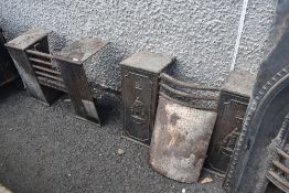 Two vintage cast iron fire grates