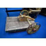 An early 20th century folk art style dog cart with Gypsy style paint work.