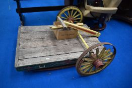 An early 20th century folk art style dog cart with Gypsy style paint work.