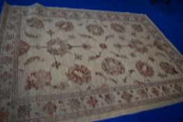 A vintage rug in shades of brown and cream, approx 180 x 130cm