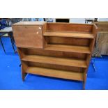 An Arts and Crafts golden oak bookshelf with bureau section, in the Arthur Simpson style with