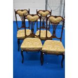 A set of late 19th or early 20th Century salon chairs with fan back design having upholstered