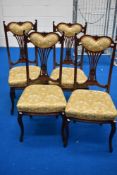 A set of late 19th or early 20th Century salon chairs with fan back design having upholstered