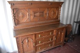 A late Victorian Gillow's of Lancaster oak sideboard, with raised and panelled back with barley