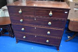 A 19th century mahogany chest of two short and three long drawers, each with cockbeading and