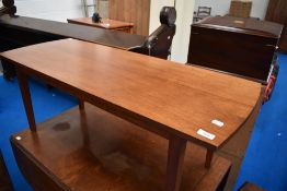 A 1970's mahogany coffee table, of oblong form with bowed ends and tapering square section legs,