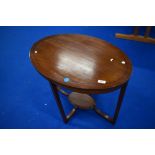 An Edwardian mahogany oval occasional table