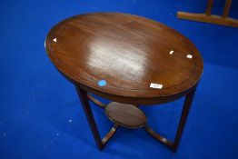 An Edwardian mahogany oval occasional table