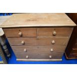 A Victorian stripped pine chest of two over three drawers