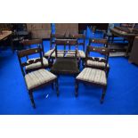 A set of six 19th Century mahogany rail back dining chairs and a similar scroll end carver chair