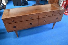 A 1970's Sepele dressing chest/sideboard with crossbanded detail to upper drawers, formally a