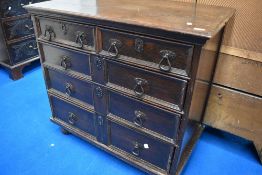 A Period oak chest of drawers in the Jacobean style having two short over three long drawers with