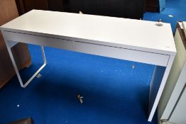 A modern with laminate desk with two drawers.