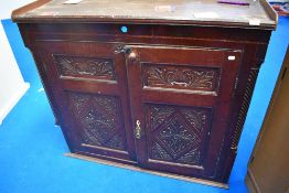 A early 20th century carved oak cupboard top.