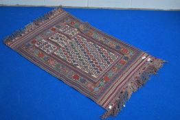An Afghan Belouch prayer rug, with stylised boteh decoration within multiple geometric borders,