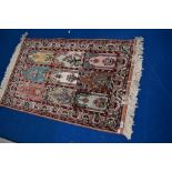 A Persian prayer rug of typical desgin, approx 107 x 62cm