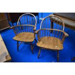 A pair of traditional spindle back windsor type chairs, stamped Yugoslavia to base, with turned