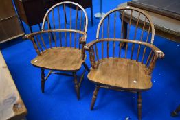 A pair of traditional spindle back windsor type chairs, stamped Yugoslavia to base, with turned