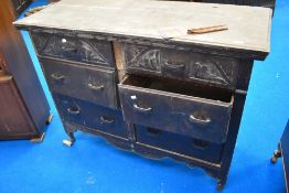 An antique chest of six large drawers with carved fronts