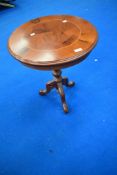 A modern yew effect circular occasional table, diameter approx. 50cm