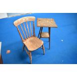 A 19th Century solid seat kitchen chair and a pokerwork plant stand