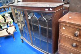 An early 20th Century mahogany bow front china cabinet on ball and claw feet, width approx 123cm