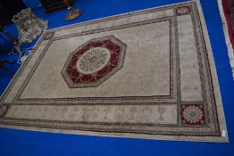 A traditional carpet square cream ground, with burgundy lozenge, approx. 230 x 170cm