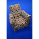 A vintage child's armchair having Libertys Ianthe style loose cover