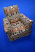 A vintage child's armchair having Libertys Ianthe style loose cover