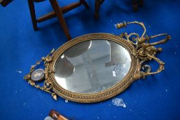 An Adams style wall mirror with three branch candle holders