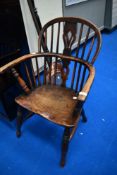 A late 18th/early 19th Windsor chair having typical back, turned frame and H stretcher