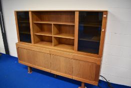 A vintage teak sideboard with part glazed top section