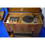 A vintage walnut cased radio gram with Collaro turntable